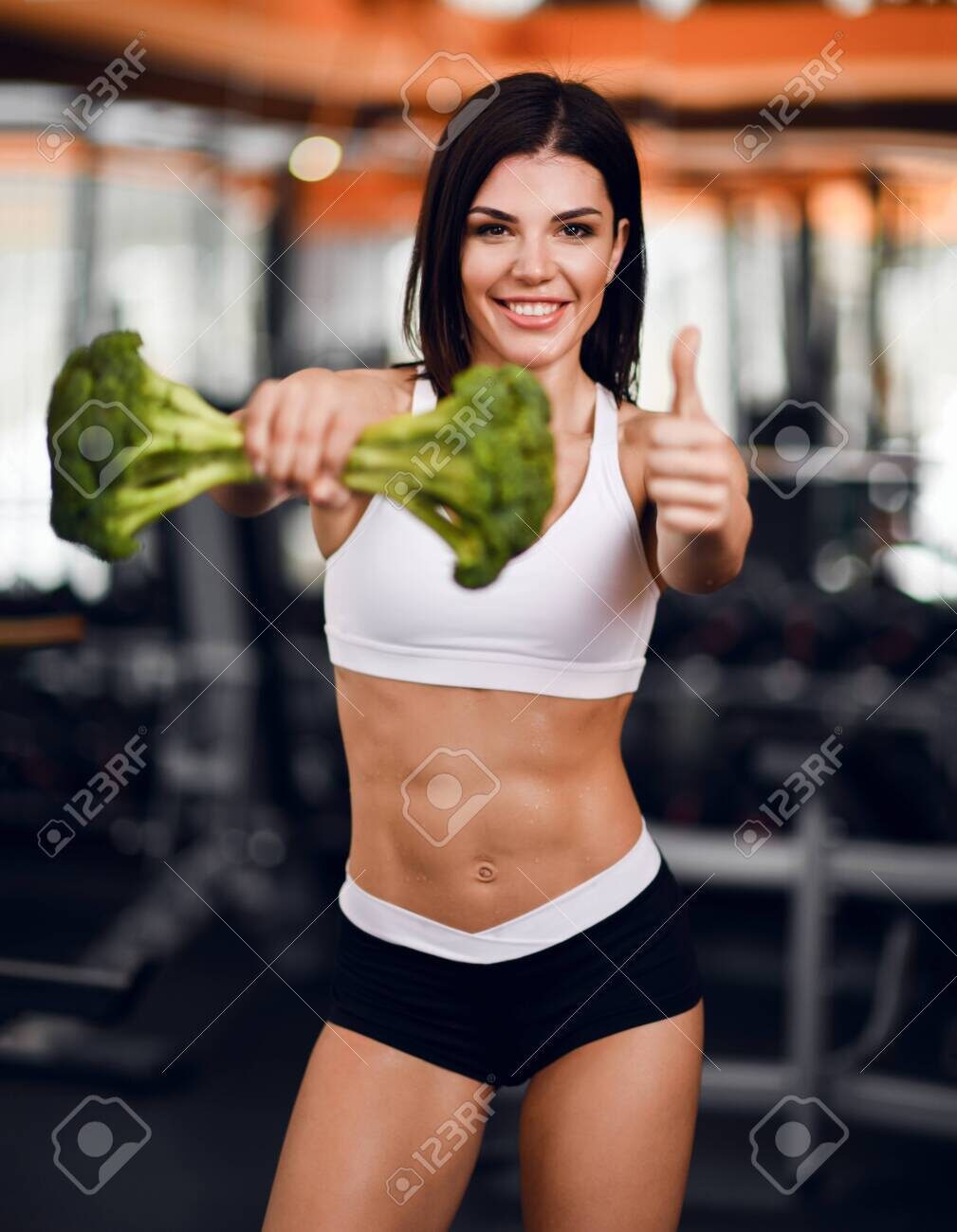 123992608-diet-and-weight-loss-concept-happy-smiling-athletic-girl-fitness-instructor-brunette-handed-us-big-b-9677080