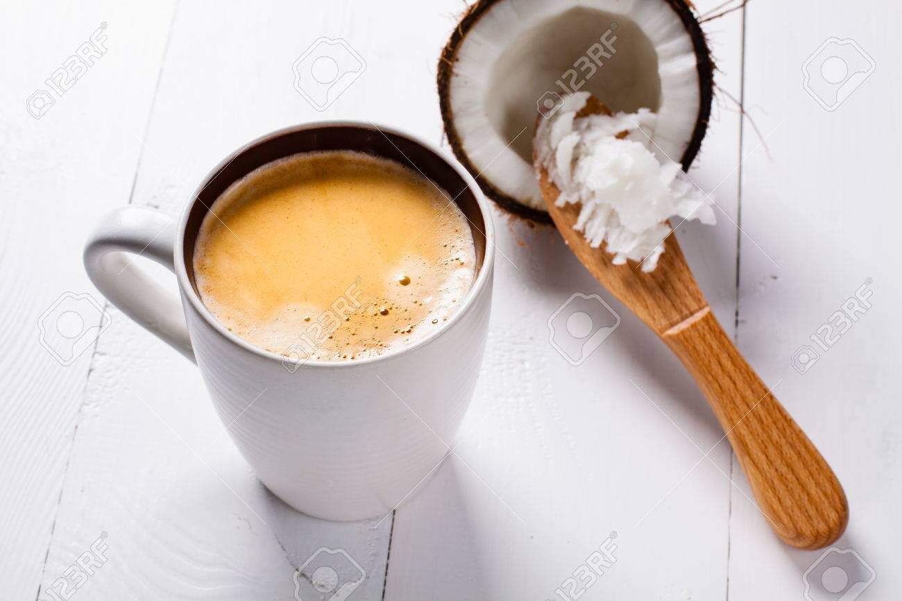 bulletproof-coffee-its-a-coffee-blended-with-butter-or-coconut-oil-wiev-from-above-on-coffee-and-coconut-part-of-ketogenic-diet-better-choice-before-trainning