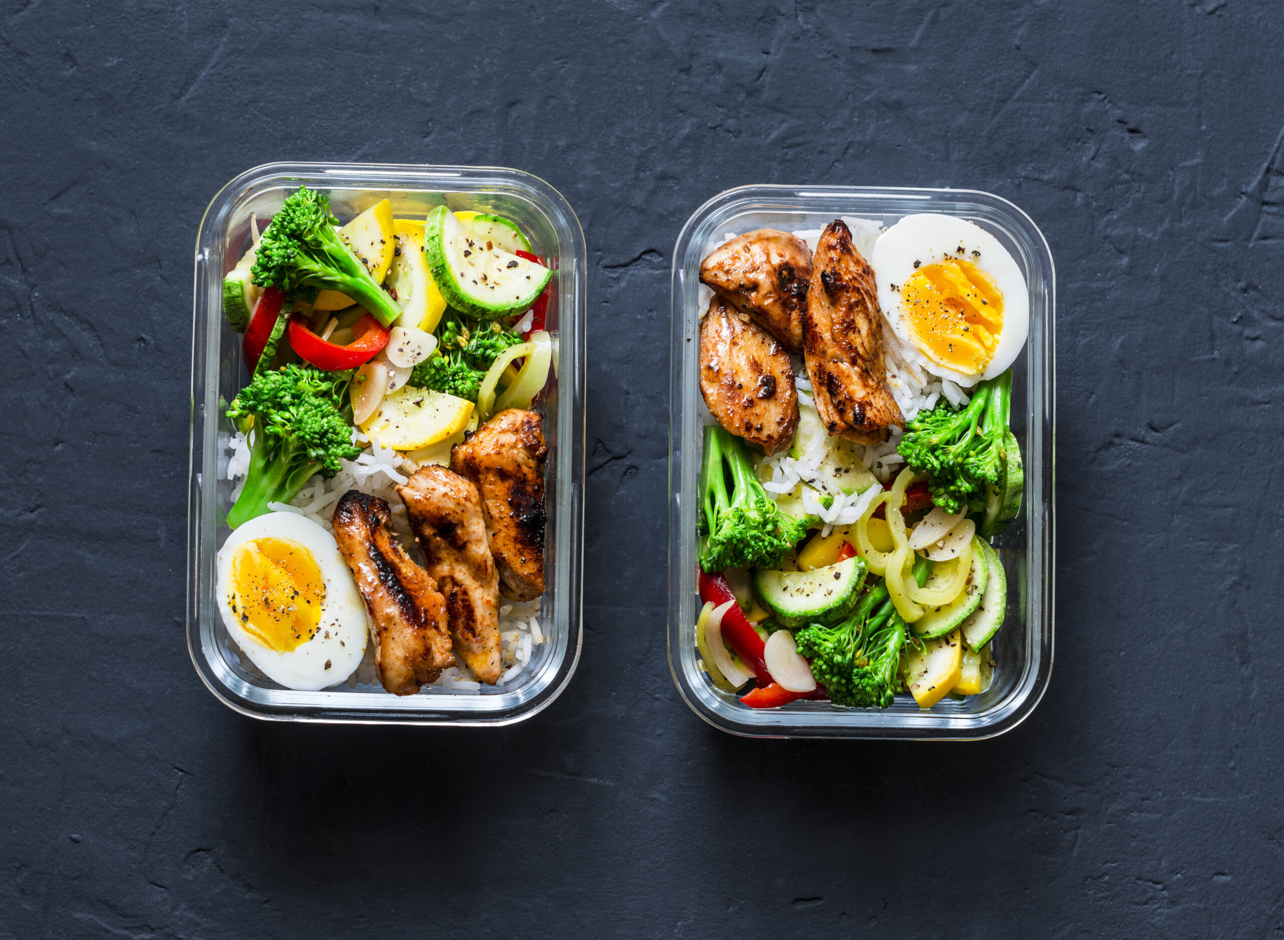 rice-stewed-vegetables-egg-teriyaki-chicken-healthy-balanced-lunch-box-on-a-dark-background-top-view-home-food-for-office-concept