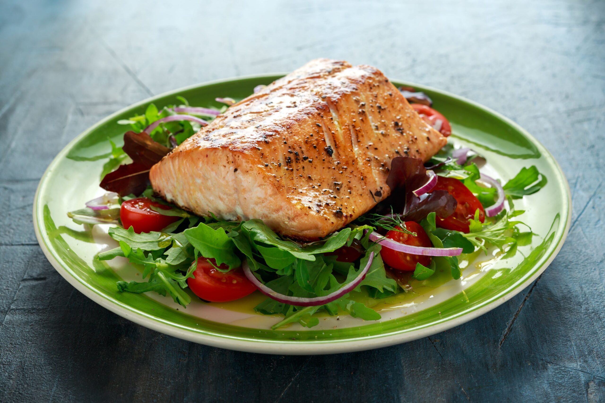 baked-salmon-steak-with-tomato-onion-mix-of-green-royalty-free-image-854594972-1543262353-1560920