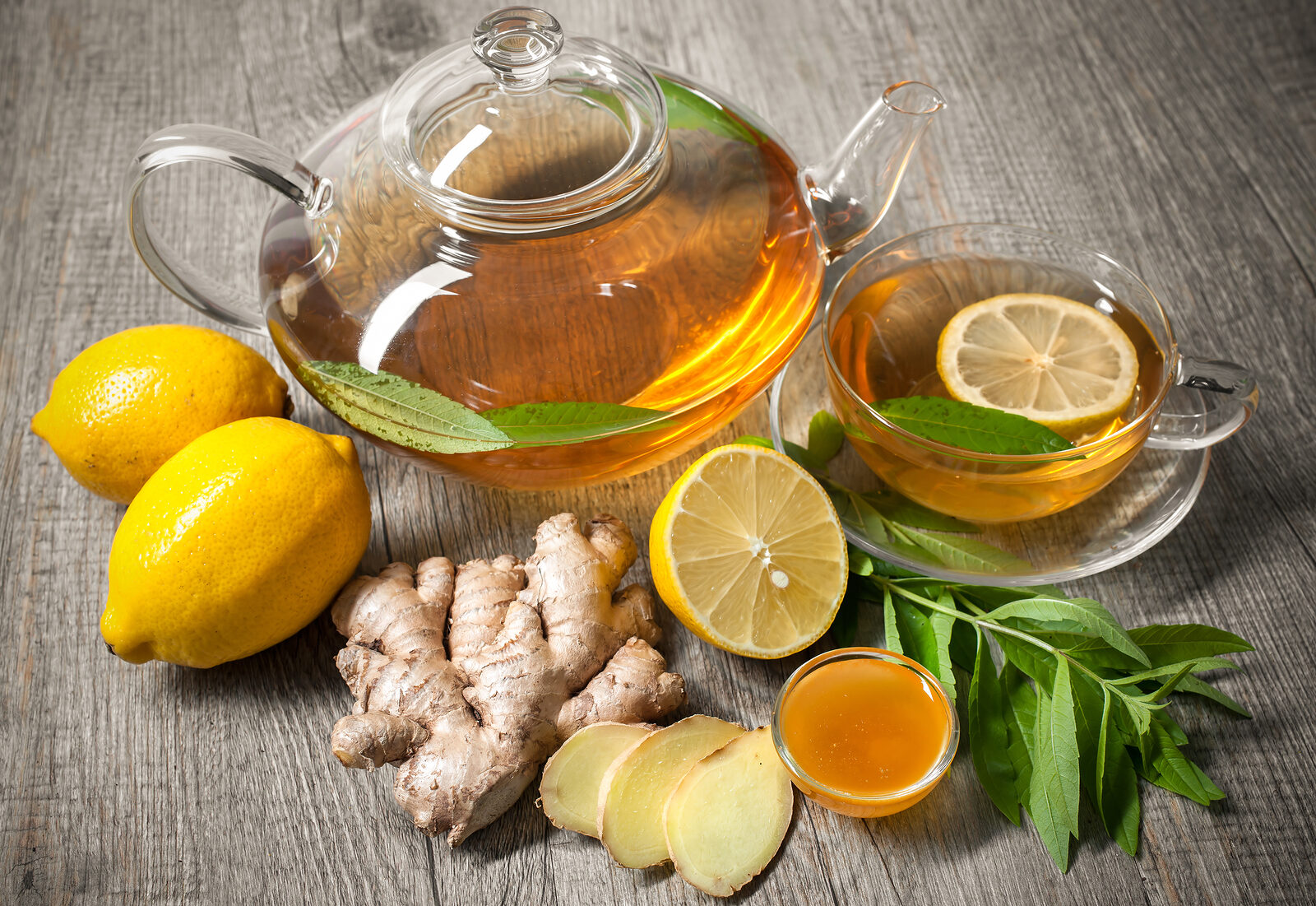 cup-of-ginger-tea-with-honey-and-lemon-on-wooden-table