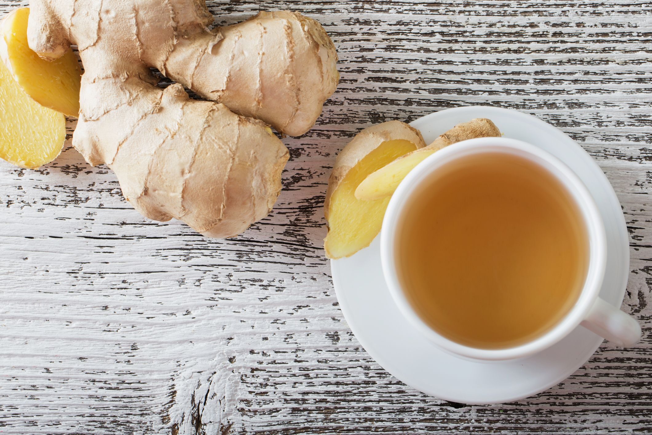 ginger-tea-in-a-white-cup-on-wooden-background-royalty-free-image-492223016-1547048096-8588852