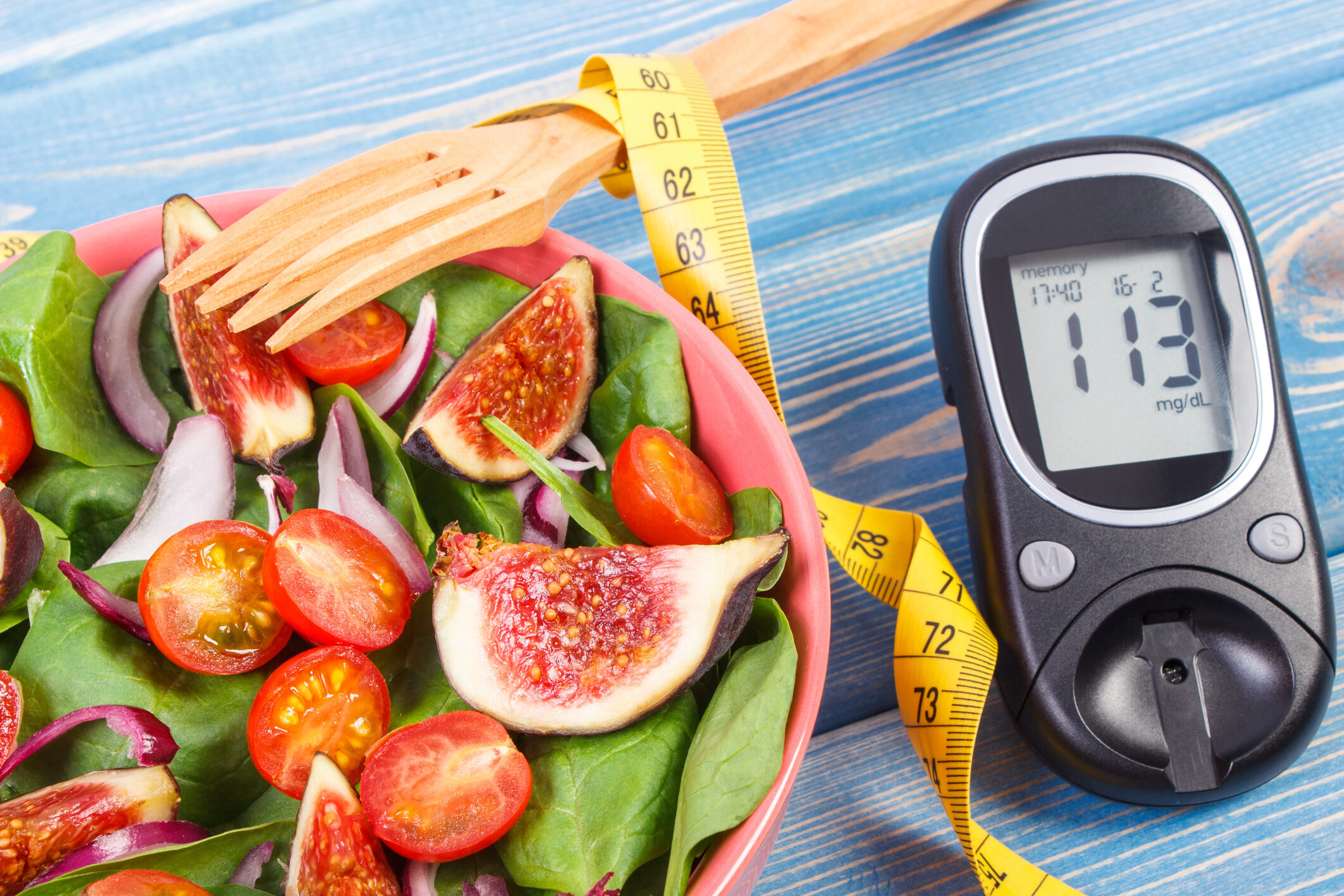 fruit-and-vegetable-salad-and-glucometer-with-tape-measure-concept-of-diabetes-slimming-and-healthy-nutrition