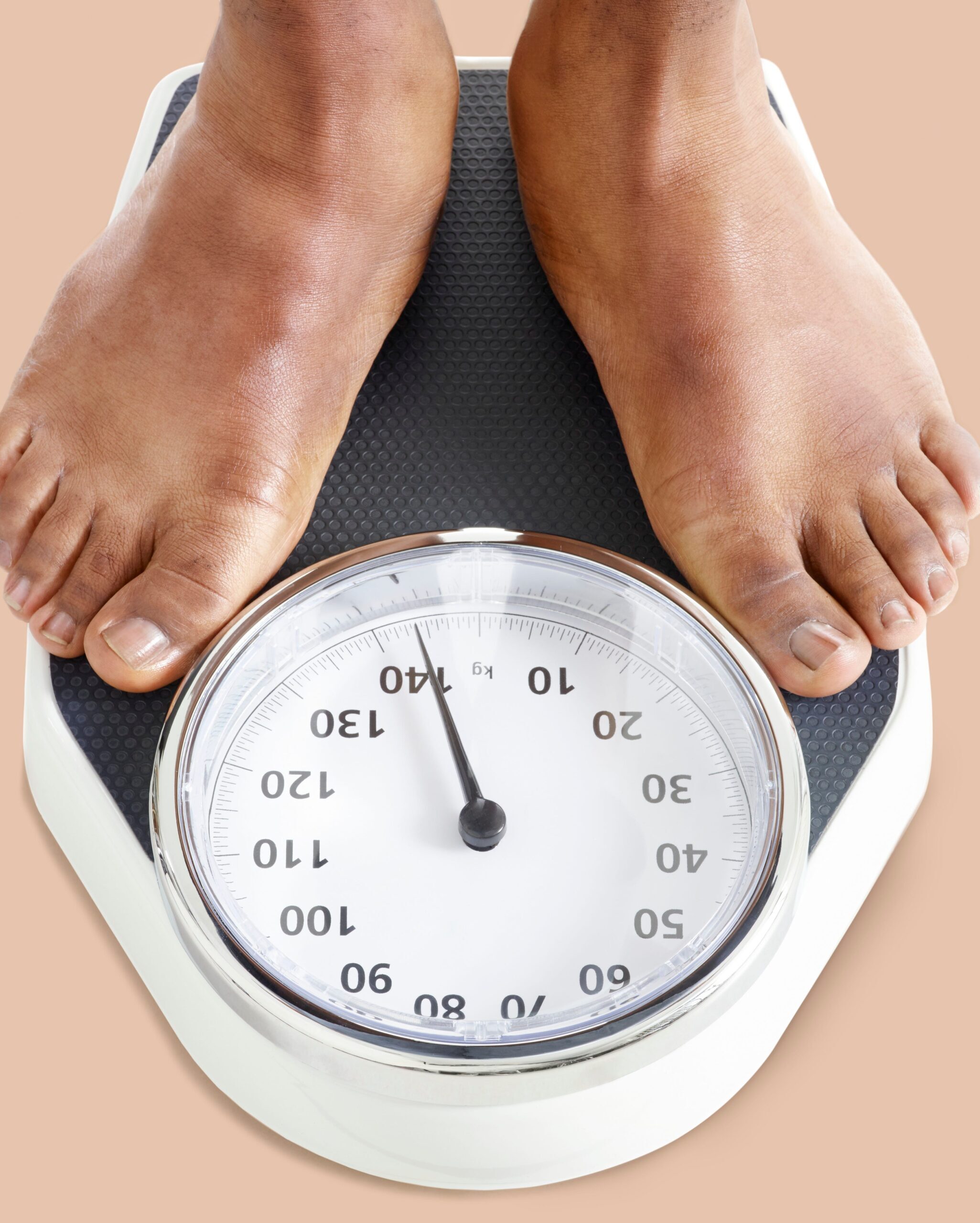 man-standing-on-weighing-scales-royalty-free-image-956351584-1543528449-9839010