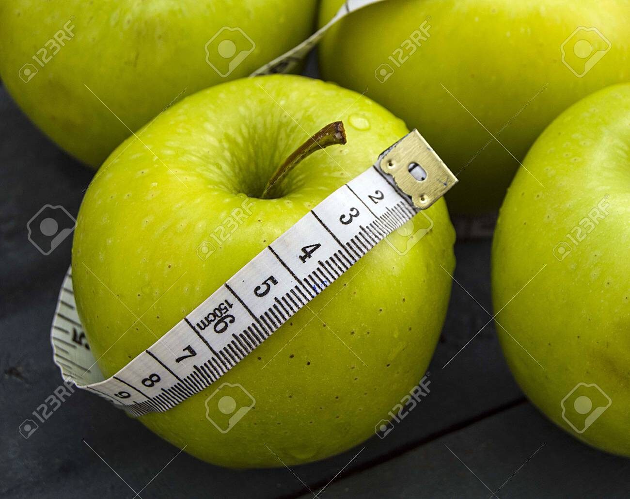 86795388-to-lose-weight-to-lose-weight-to-eat-apples-to-eat-to-lose-weight-to-lose-weight-to-be-eaten-green-a-6613336