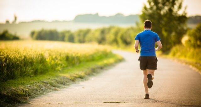 male-athlete-runner-running-on-road-jog-workout-well-being-concept