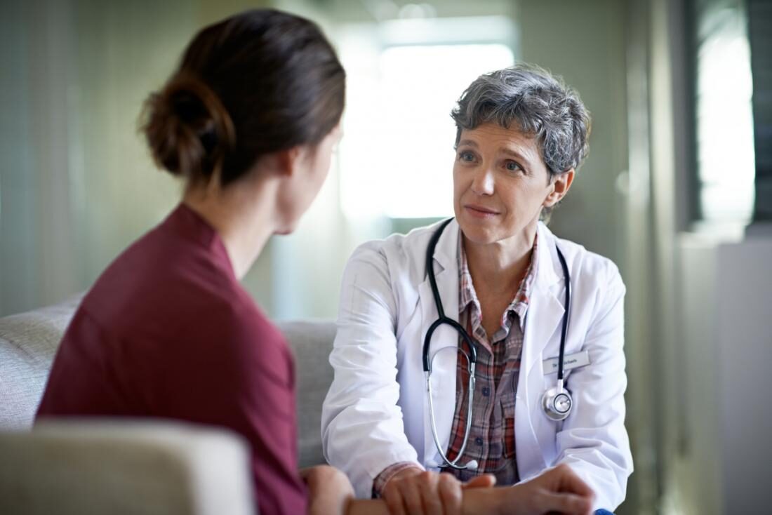 doctor-comforting-a-patient-5792235