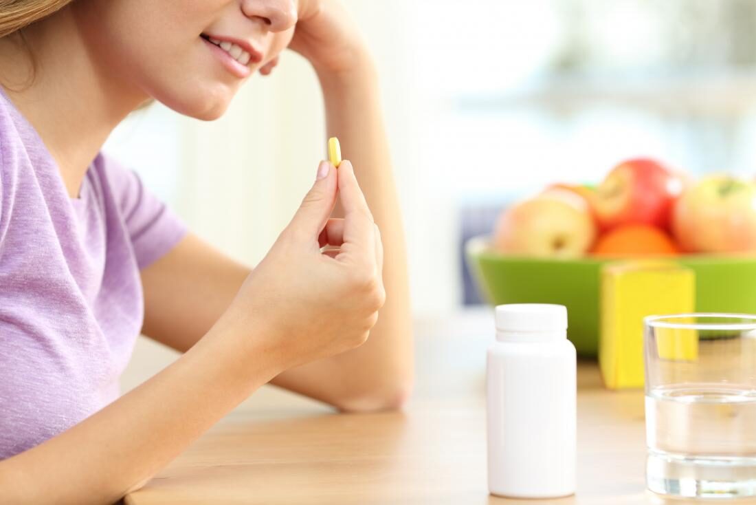 girl-taking-a-supplement-8693325