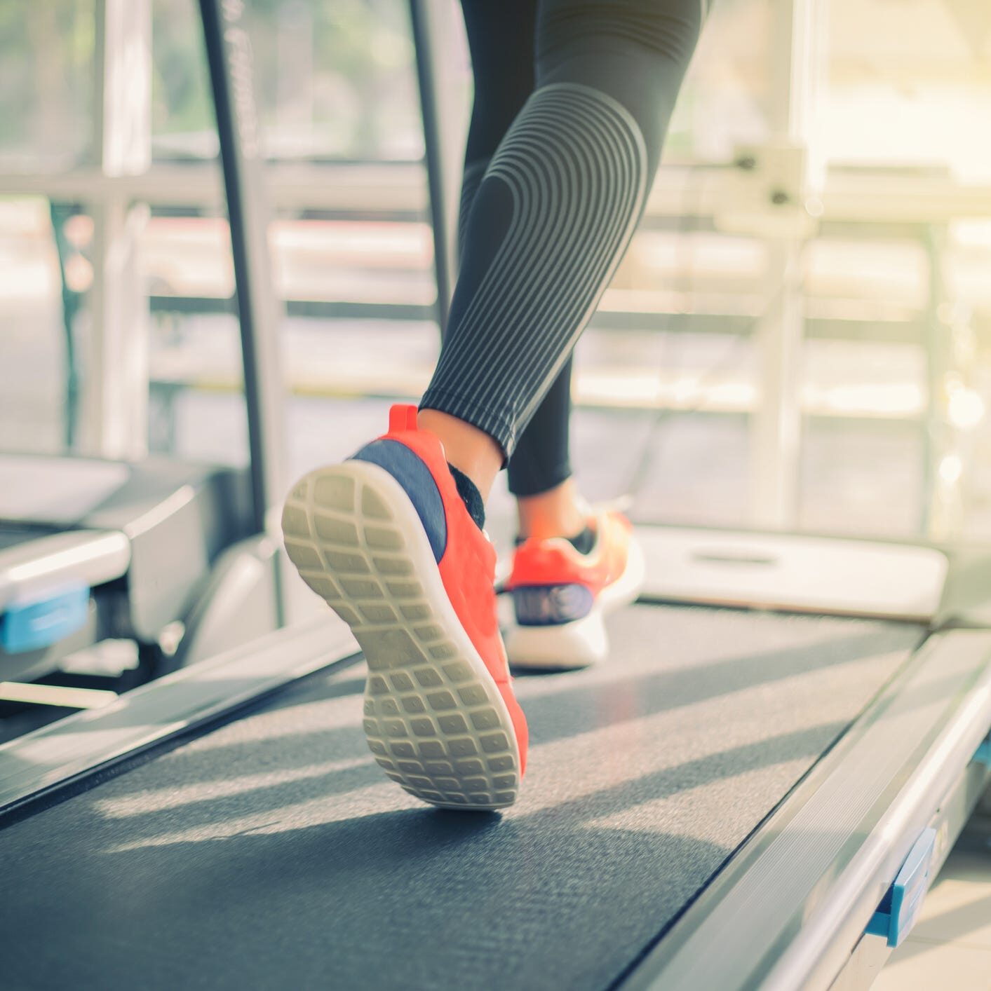 low-section-of-woman-running-on-treadmill-in-gym-royalty-free-image-925832428-1560533333-2298862