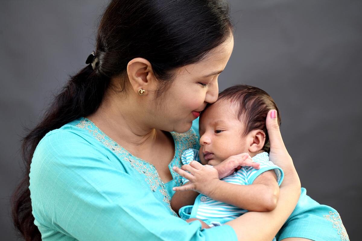 cheerful-mother-with-newborn-baby