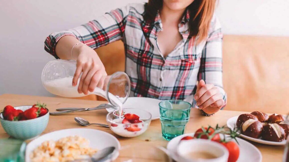 woman-pouring-milk-into-bowl-1296x728-5543977